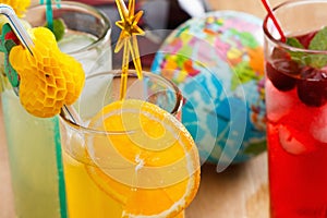 Summer beverages, cocktail with ice, juice and fruit.