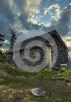 Summer and big sky landscapes of mountains and valleys in the high alpine with snow capped peaks