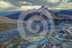 Summer and big sky landscapes of mountains and valleys in the high alpine with snow capped peaks