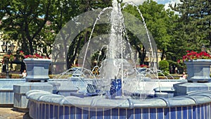 Summer blue urban cascading fountain in the central park