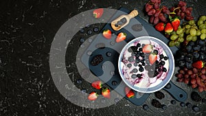 Summer breakfast with yoghurt and berries creative flatlay top view