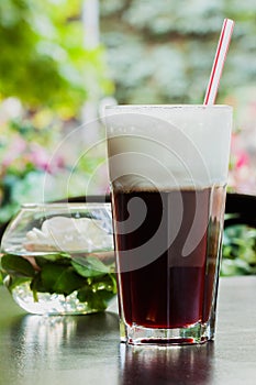 Summer, cafe , terrace, large glass tumbler of refreshing coffee glissade photo