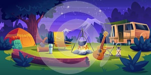 Summer camp at night time. Rv caravan at campfire