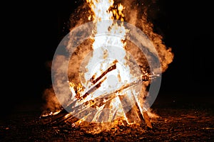 Summer campfire flame at night in nature