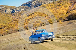 Summer car travel freedom woman in Yosemite National Park with arms raised up cheerful and happy. Summer road trip