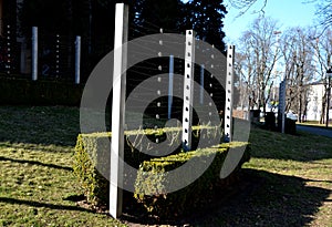 Summer castle parterre with honestly cut boxwood hedge and metal stainless steel trellises. with circle buckles. Boxwood also form