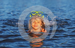 Summer child. Funny child on beach. Boy swim in sea on summer holidays. Happy kids swimming in the water. Little boy