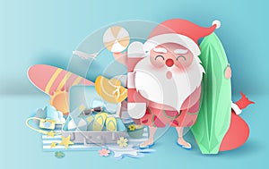 Summer Christmas season with suitcase concept.Santa Claus smile wearing beach suit travel swimming decoration.Holiday and vacation