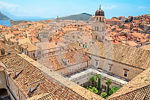 Summer cityscape - top view of the Franciscan Church with Monastery and the Old Town of Dubrovnik