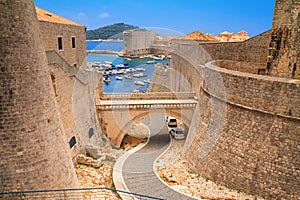 Summer cityscape - view of the bridge between the Revelin Fortress and the Ploce Gate in the Old Town of Dubrovnik