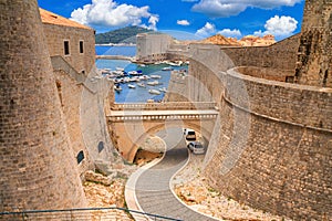Summer cityscape - view of the bridge between the Revelin Fortress and the Ploce Gate in the Old Town of Dubrovnik