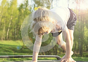 Summer. A clear, sunny day. girl with white hair getting ready to run