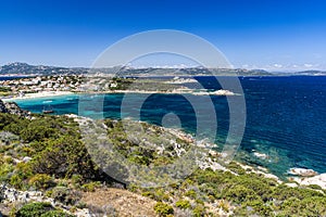 Summer, Cliff Top View Looking Down on Cala Batistoni Beach and Baia Sardinia Village with Surrounding Countryside.