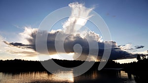 Summer cloud Storforsen rapids waterfall in Sweden photo