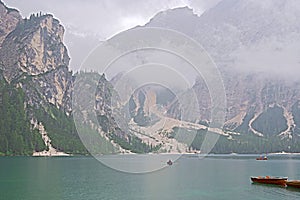Summer cloudy day at Lago di Braies. Rainy weather.