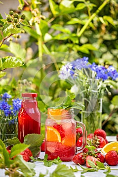 Summer cocktail with fresh strawberries and strawberry juice
