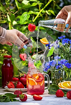 Summer cocktail with fresh strawberries and strawberry juice