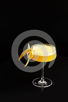 Summer Cocktail - Pornstar Martini. Drink with Passion fruit, Vodka, Liqueur, Vanilla Syrup, Champagne and Lime Juice. Black