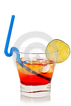 Summer cocktail in transparent glass with cherry, lime, and ice isolated on white background