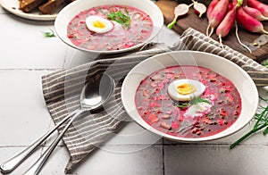 Summer cold beetroot soup with sour cream and egg