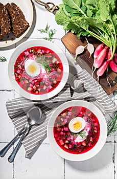 Summer cold beetroot soup with sour cream and egg