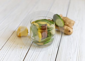 A summer cold refreshing healthy appetizing drink with water, lemon, ginger, mint leaves and cucumber