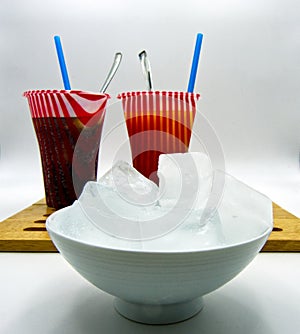 Summer colorful frozen drinks, ice cubes in a jar, white background