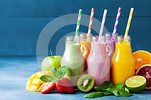 Summer colorful fruit smoothies in jars with ingredients. Healthy, detox and diet food concept