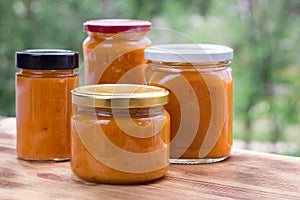 Summer composition of apricot jam cans prepared from fruit harvest