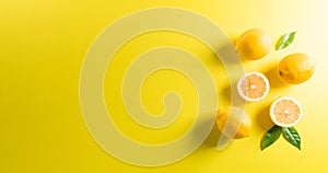 Summer composition made from oranges, lemon or lime on pastel yellow background. Fruit minimal concept. Flat lay, top view, copy