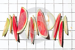 Summer concept with sliced melon and watermelon pieces put in a raw