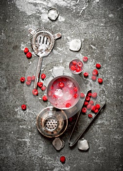 Summer cooling cocktail of wild raspberries with ice.