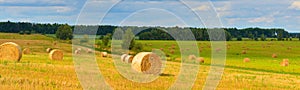 Summer countryside with haystacks in field season