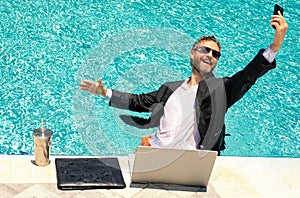 Summer crazy business man. Freelancer speak phone on summer sea beach. Crazy freelancer in suit in water. Crazy