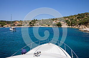 Summer cruise vacation on a yacht off the coast of Kastos island, Ionian sea, Greece.