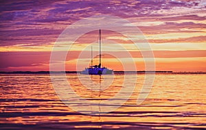 Summer cruise. Yacht boat on the sea. Sailboats at sunset. Ocean yacht sailing.