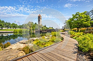 Summer day along the Spokane River in Riverfront Park with the Clock Tower, Pavilion and walking path in view