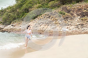 Summer day. Asian lifestyle women relaxing, jumping and happy on the beach.