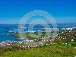 On a summer day with blue skies, a ferry to Ireland sails from the port of Holyhead on the island of Anglesey in North Wales