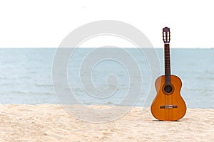 The Summer day with Guitar Classic for relax on the beautiful beach wiht copy space.