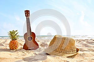 The Summer day with Guitar ukulele for relax on the beautiful beach