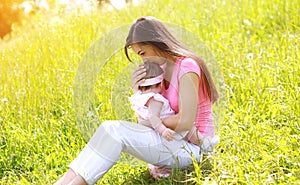 Summer day, happy mother and child outdoors