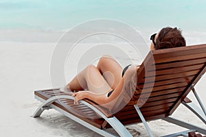 Summer day lifestyle woman relax near luxury  sunbath at the beach resort in the hotel.