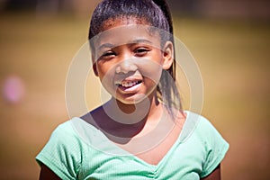 Summer days mean lots of smiles. Portrait of a cute young girl enjoying a day in the park.