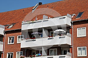 Summer in Denmark people use summer umbrellas on balcony