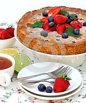 Summer dessert - homemade cake with fresh strawberries and blueberries