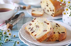 Summer dessert. Raisin cake and two cups of tea, rustic style