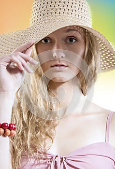 Summer dreamer girl with straw hat on the beach