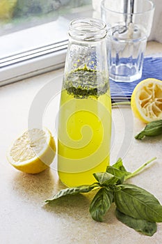 Summer drink with lemon, basil and soda