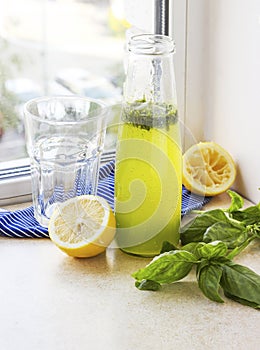 Summer drink with lemon, basil and soda